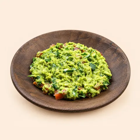 Guacamole in a wooden bowl