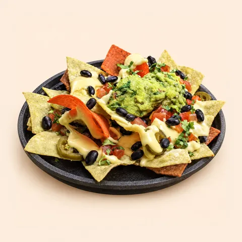 Nachos with cheese, beans and guacamole