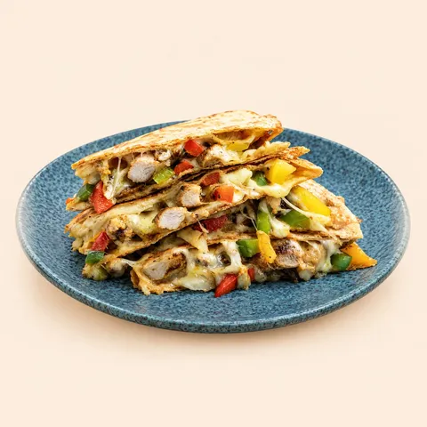 Chicken fajita quesadilla on a blue plate