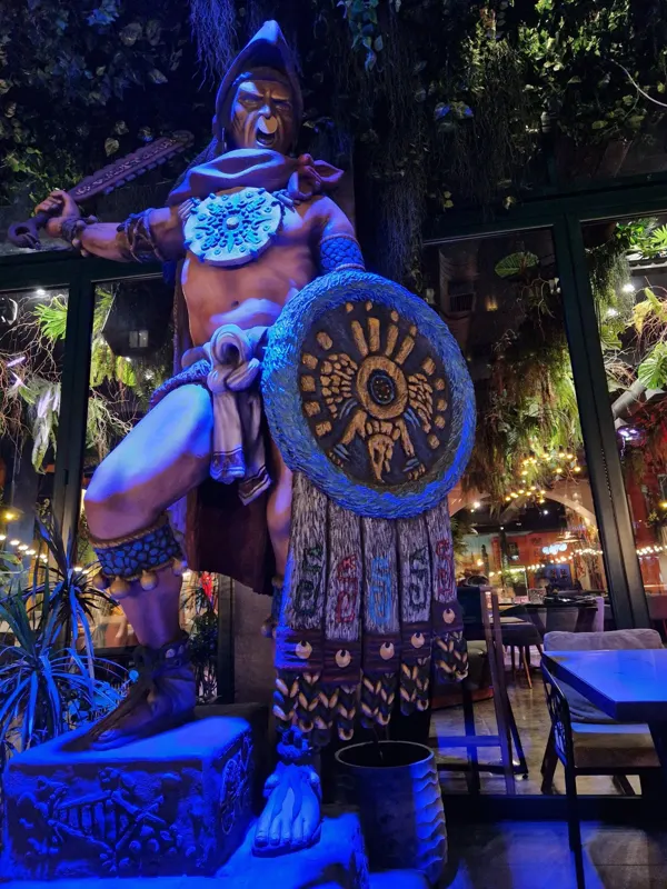Aztec warrior statue at the entrance